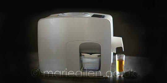 image of silver yoda home pro on a dark background with glass of black seed oil proclaiming health
